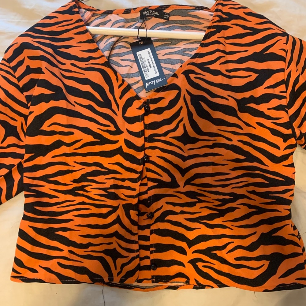 Tiger striped button down long sleeve crop top.
